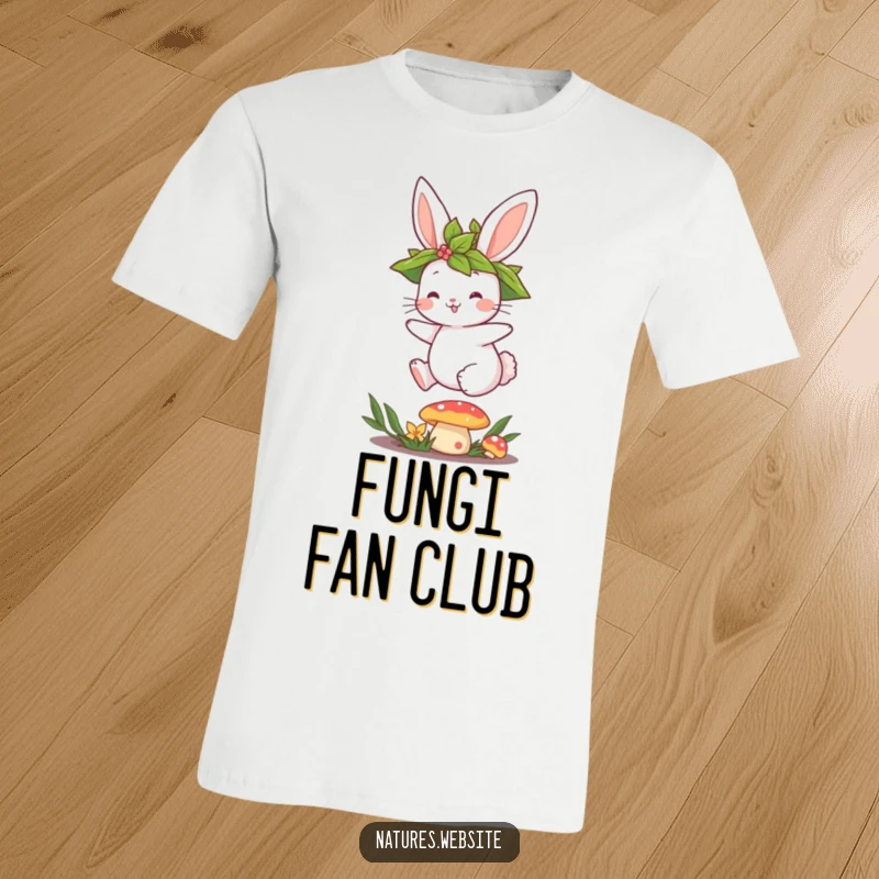 Funny t-shirt featuring a cute bunny with a leaf crown, excitedly jumping over a mushroom in a whimsical scene.